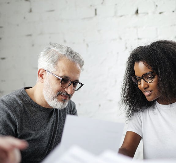 a man listening to a woman explaining